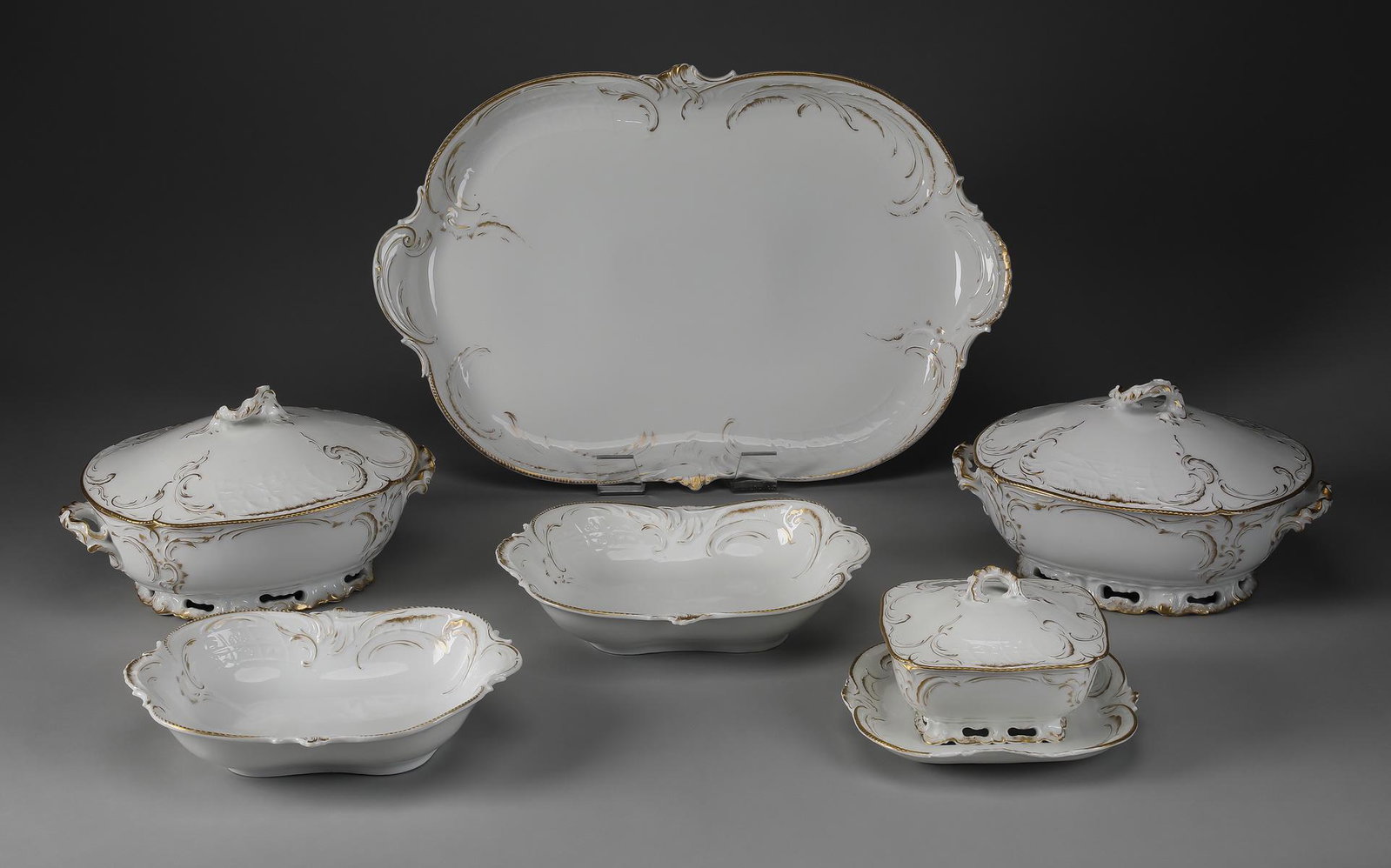 (6) pcs Rosenthal & Company serving pieces: (6) pcs Rosenthal & Company parcel gilt serving pieces in the Rococo taste, late 19th to early 20th century, having asymmetrical raised floral trellises and C-scrolls, maker marked in green ‘R&C San