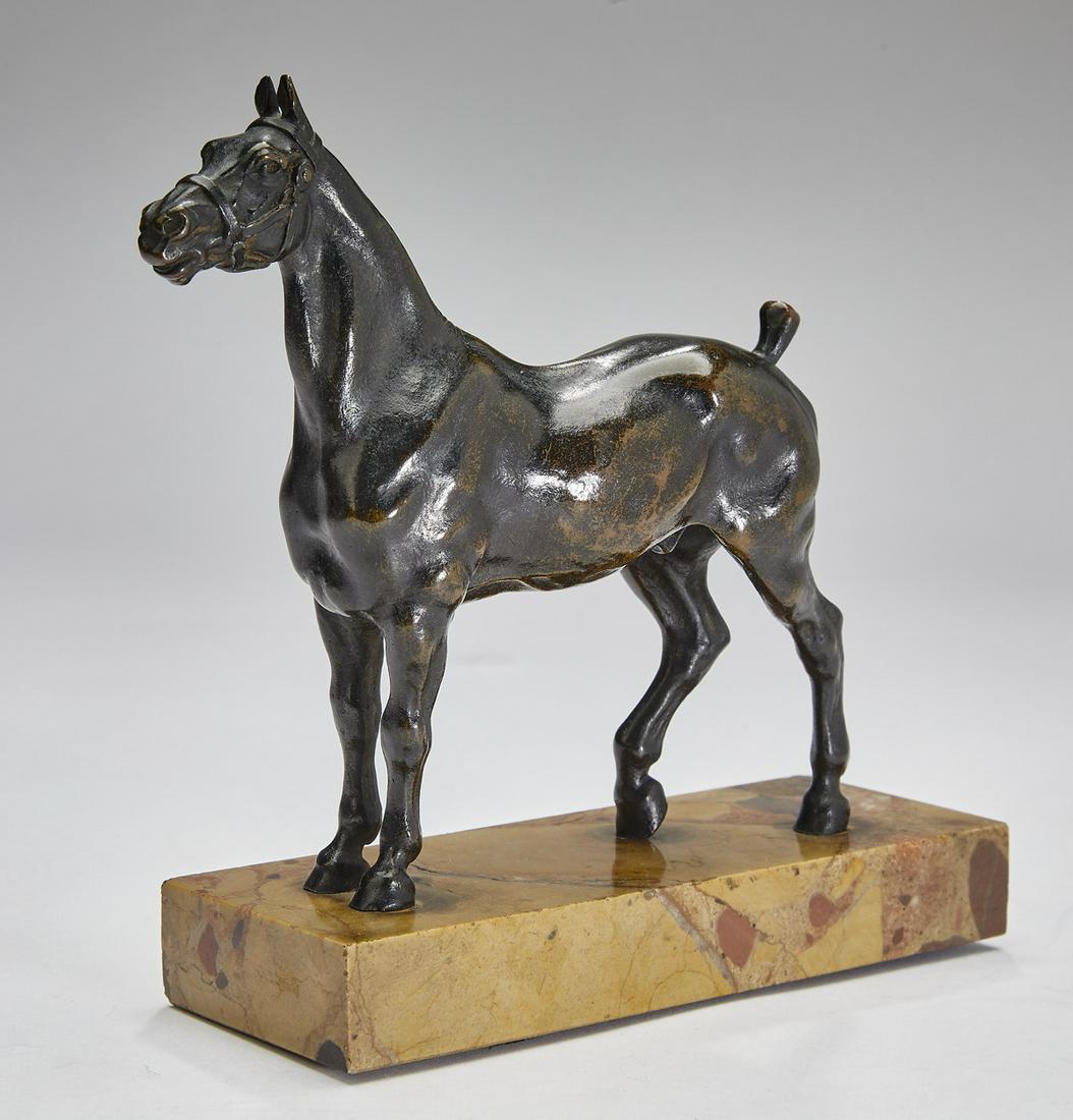 Signed French bronze horse sculpture: Signed French bronze horse, the animal depicted standing with a bobbed tail, signed indistinctly underneath, the whole resting on a sienna marble base, 5"h x 5.5"l x 2"w; overall with base, 6"h x 5.75