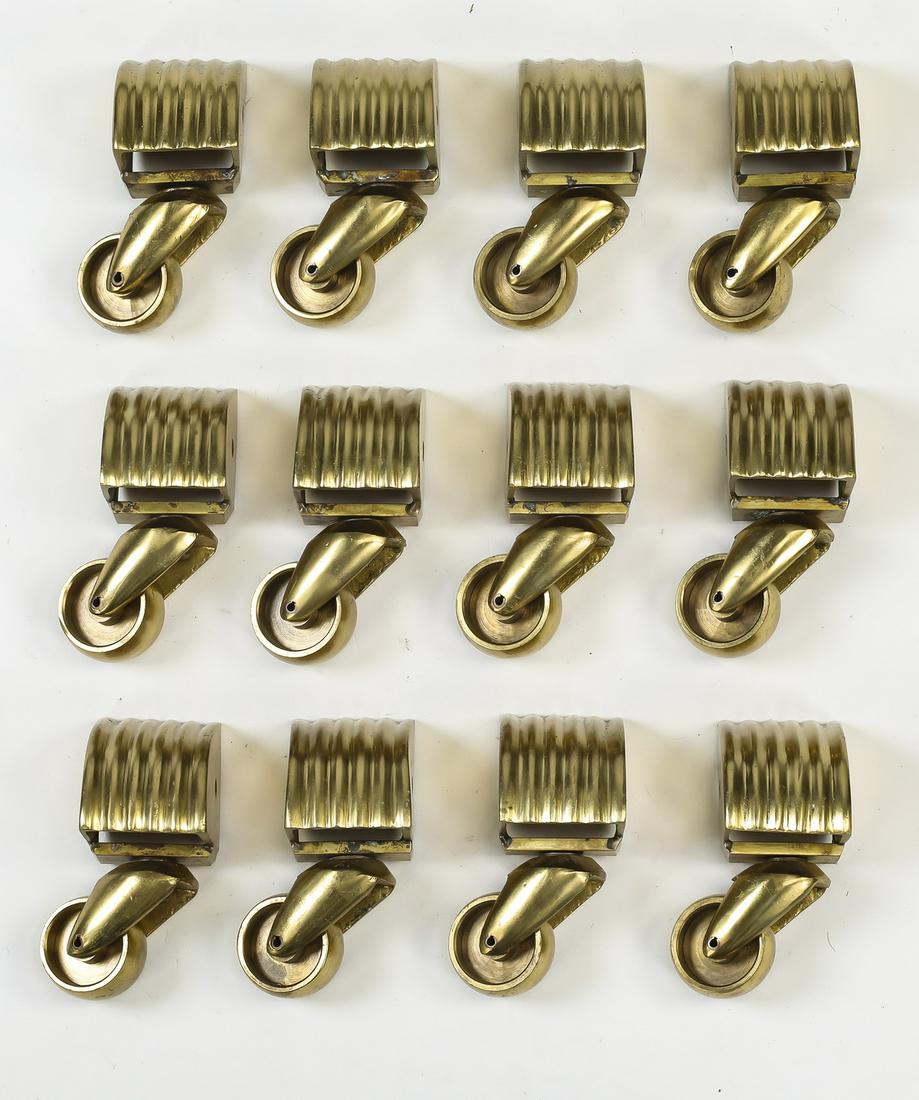 Group of (12) bronze casters, 4.5"h: Group of (12) bronze casters, each having fluted caps, 4.5"h x 2"w x 2"d.
