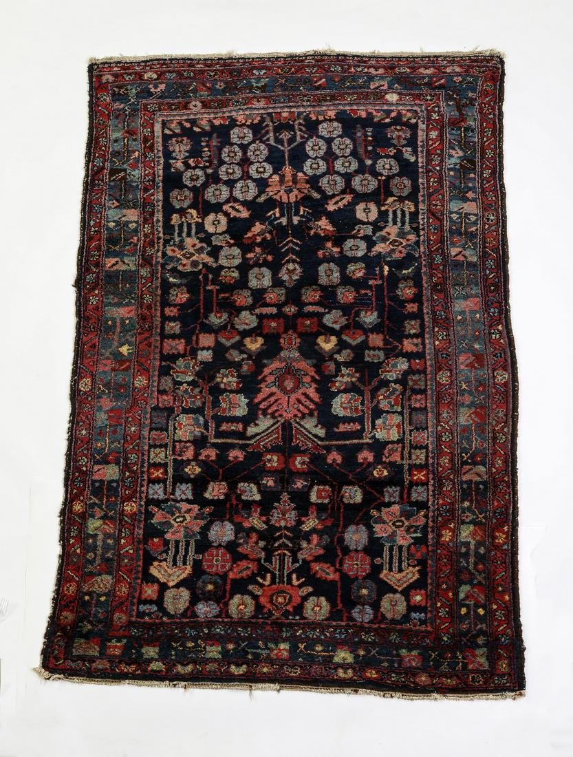 Hand knotted wool Persian Hamadan, 6 x 4: Hand knotted wool Persian Hamadan rug, executed with some natural dyes, having an all over vine and palmette pattern in red, pink and indigo on a navy ground, with a stylized Herati border, 6' 7"l x 4