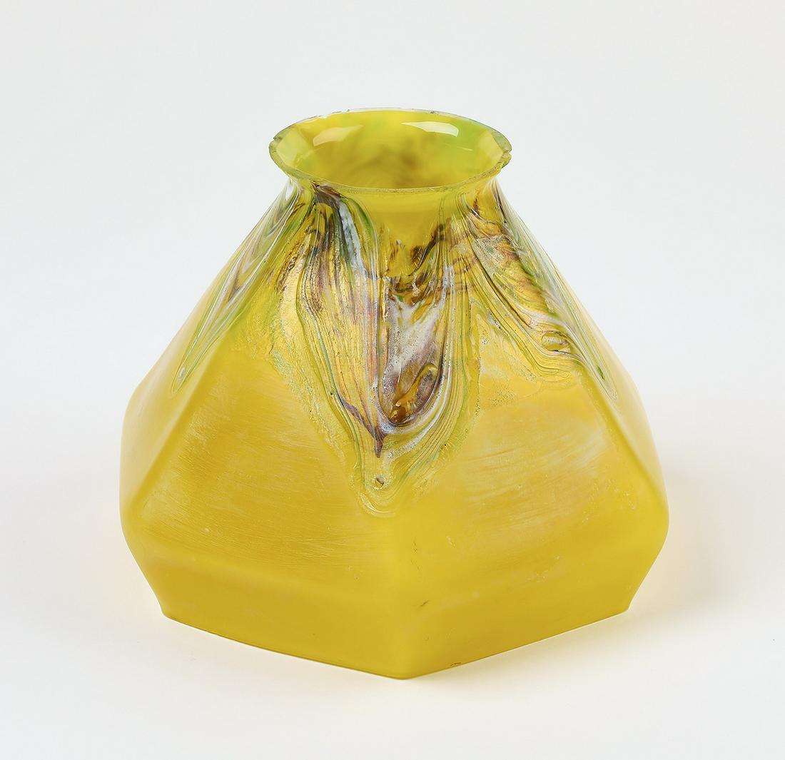 Art glass lamp shade w/ gold aureen: Art glass lamp shade, of paneled bell form, having a pulled feather swag design in gold aurene, russet, and green glass, on a lemon ground, 6.25"h x 8"dia; fitter 3.20"dia.