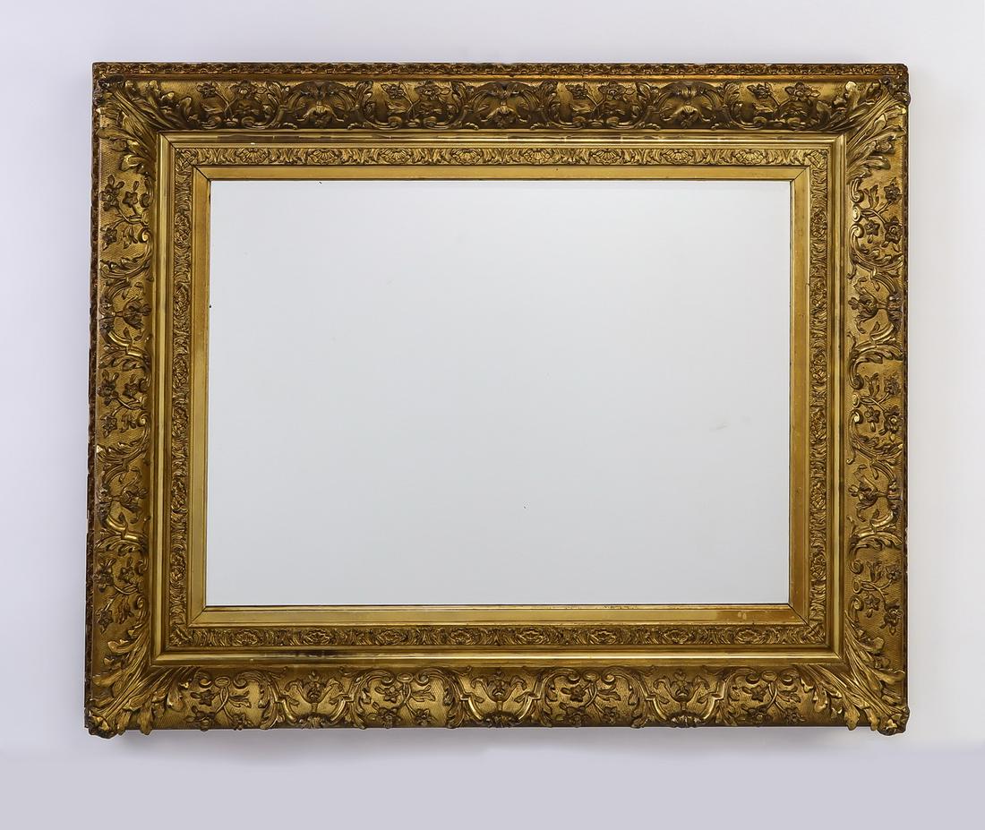 Baroque style giltwood mirror, 45"w: Baroque style giltwood mirror, early 20th century, having an outer frame decorated with scrolling flowers on an incised diaper background, surrounding an inner frame with a repeating shell motif, 23.2