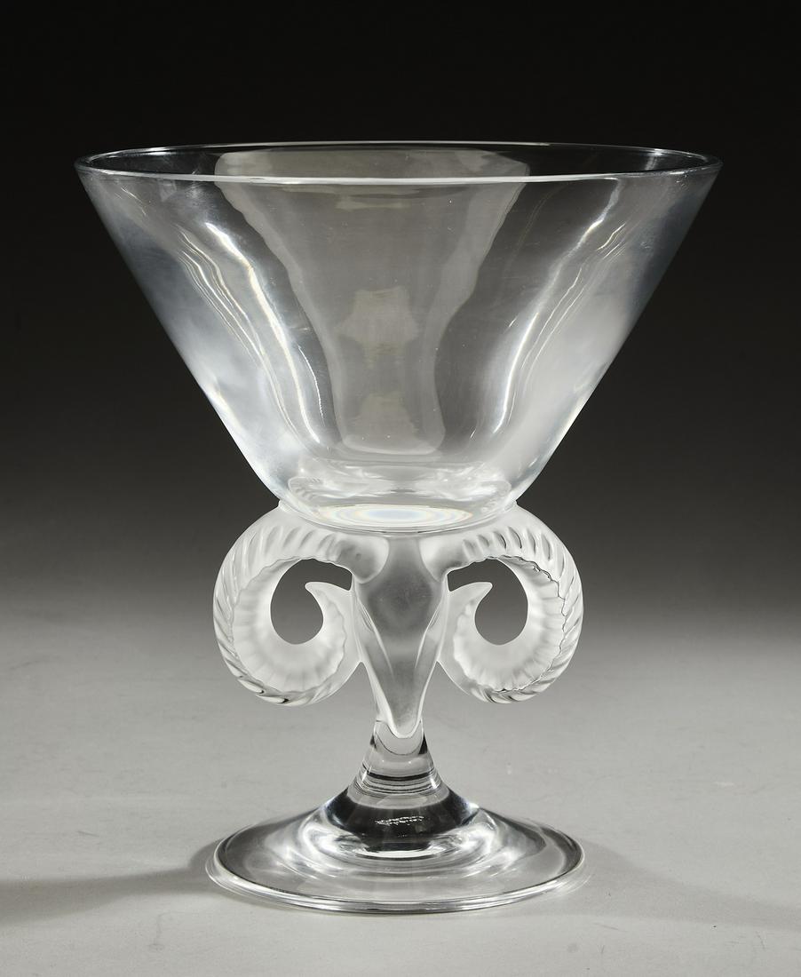 Lalique crystal 'Aries' compote, marked: Lalique crystal 'Aries' compote, having a tapering cylindrical clear crystal bowl rising on the frosted figural stem with ram's horn handles, terminating to a splayed foot, marked on the bottom, 8.5"h