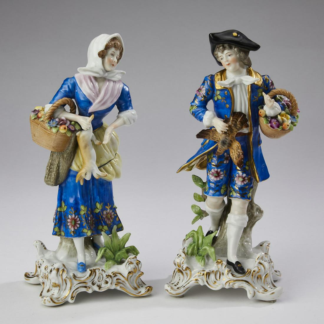 (2) Samson figures in the Chelsea taste, 19th c.: Pair of Samson figures in the Chelsea taste, late 19th century, depicting a man carrying a basket of fruit and a bird, and a woman carrying a basket of fruit and a rabbit, each resting on a Rococo bas