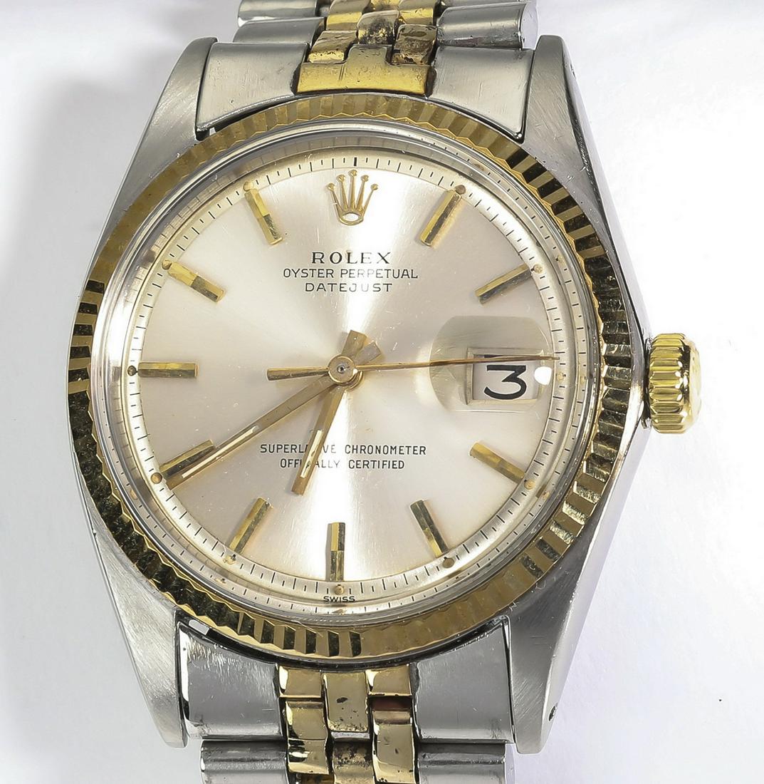 Men's SS and 18k Rolex model 1601: Men's Rolex Oyster Perpetual Datejust, model 1601, executed in stainless steel and 18k gold, the 40mm case having a silver dial with gold stick markers and a date window framed by an 18k gold fluted b