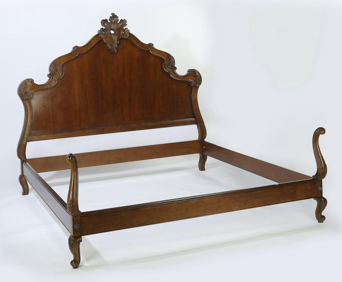 Rococo Revival style king size mahogany bed: Rococo Revival style king size mahogany bed, centering a pierce carved foliate cartouche over a shaped headboard with a carved and molded frame, having straight side and footrails surmounted at the co