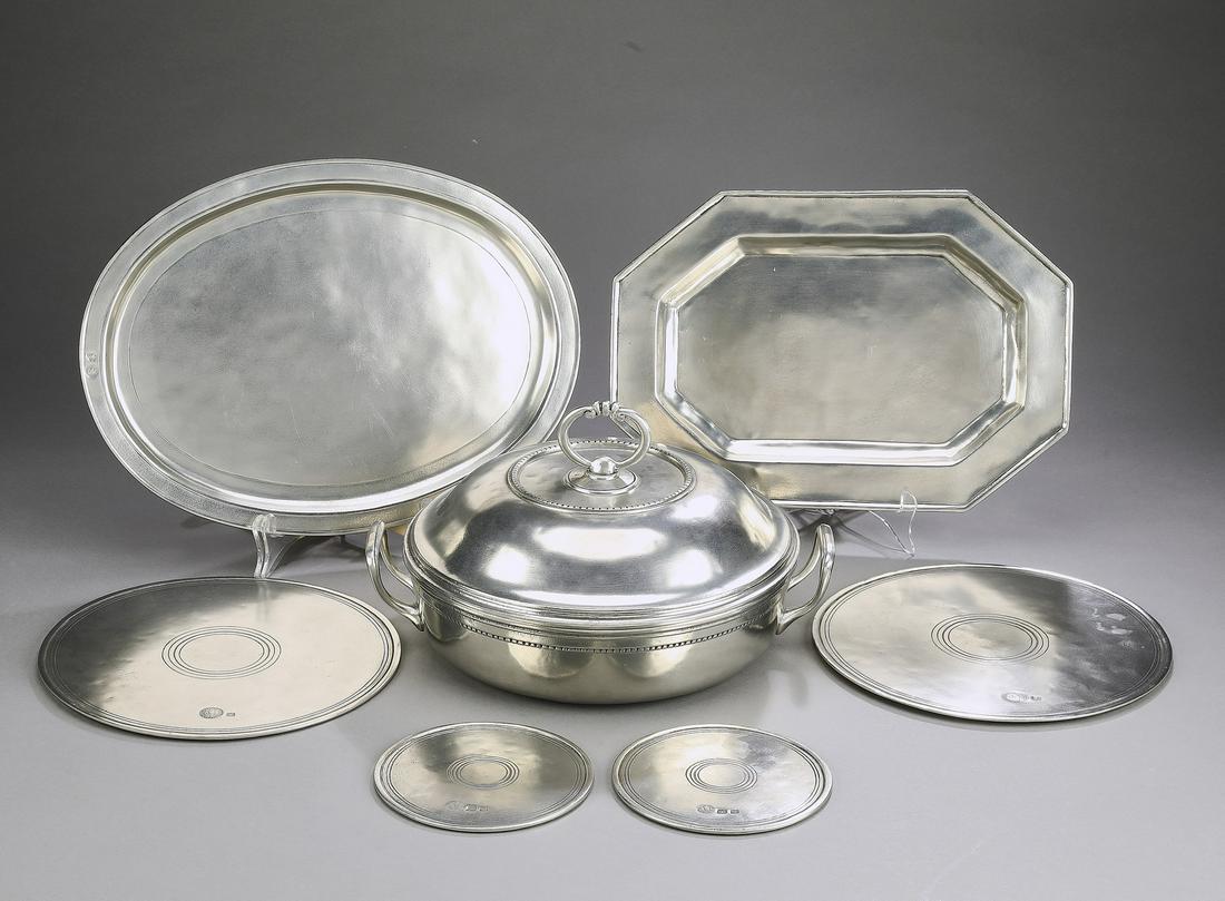 (7) Italian pewter serving pieces by Cosi Tabellini: (7) Italian pewter serving pieces by Cosi Tabellini comprising (1) covered serving dish with a Pyrex liner and a metal liner, 6.75"h x 14"l x 9.75"w (1) oval tray 15"l x 11"w; (1) rectangular tray, 13