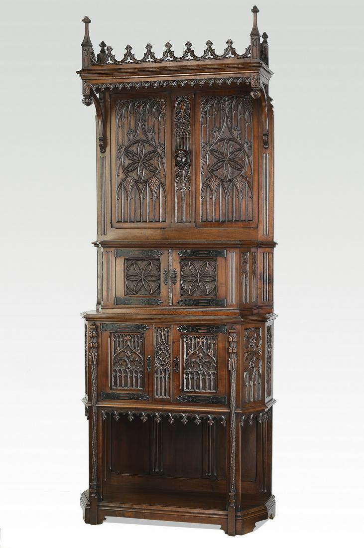 19th c. French Gothic Revival oak court cupboard: Late 19th century French Gothic Revival oak court cupboard, having a pierce carved gallery flanked by finials surmounting the molded canopy, rising on scrollwork brackets and a relief carved backsplas