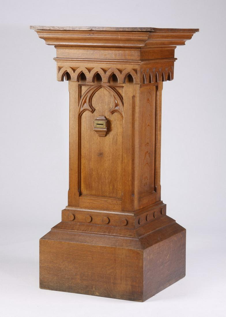 Gothic Revival carved oak pedestal, 56"h: Oversized early 20th century Gothic Revival carved oak pedestal with cathedral tracery designs, 56"h x 27.5" square top.