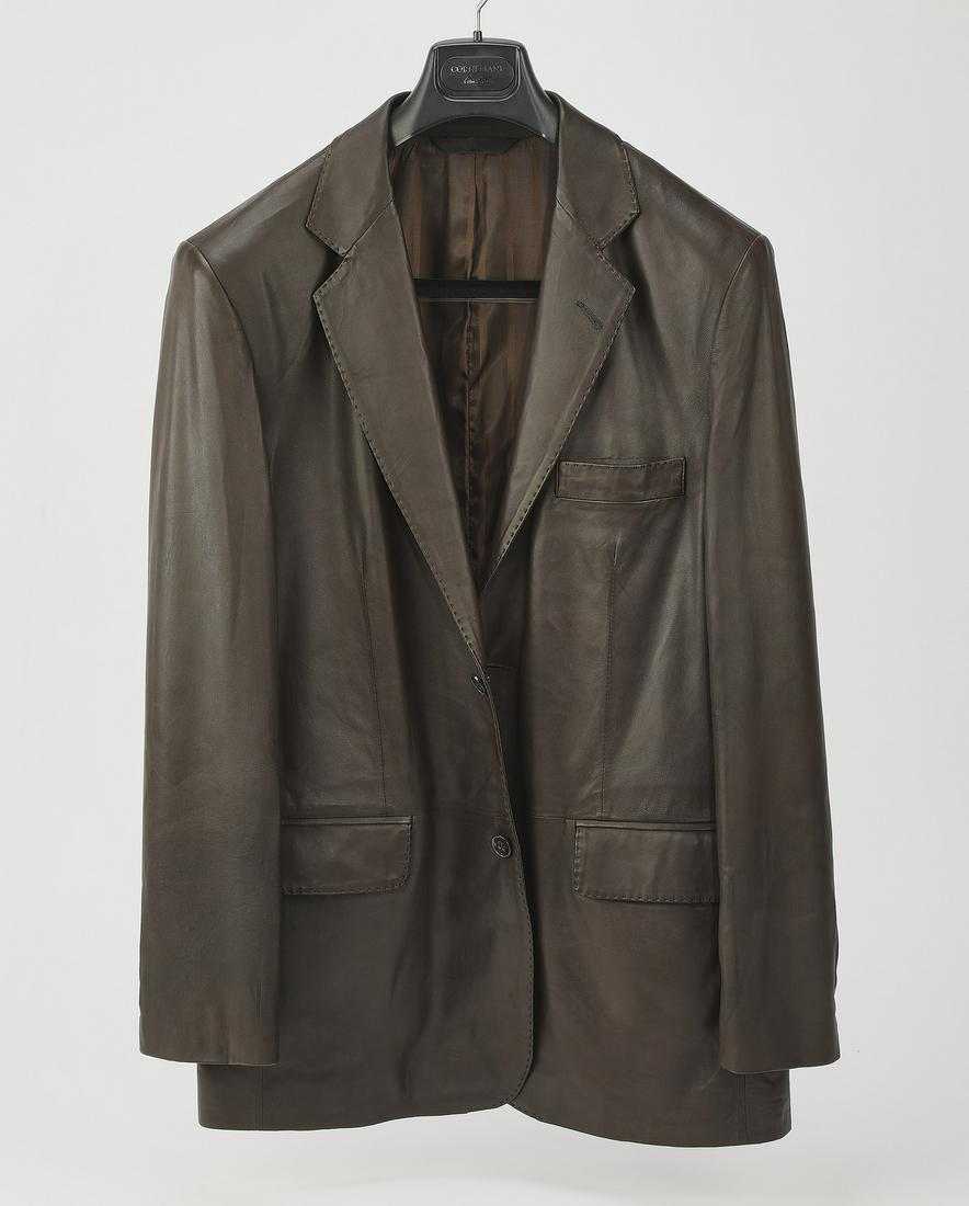 Roberto Rusanni single breasted leather jacket,: Roberto Rusanni single breasted cattleman jacket, of chocolate leather, with two buttons and horizontal pockets with flaps, having one centered back vent with a maker label and label for Gene Hiller, 