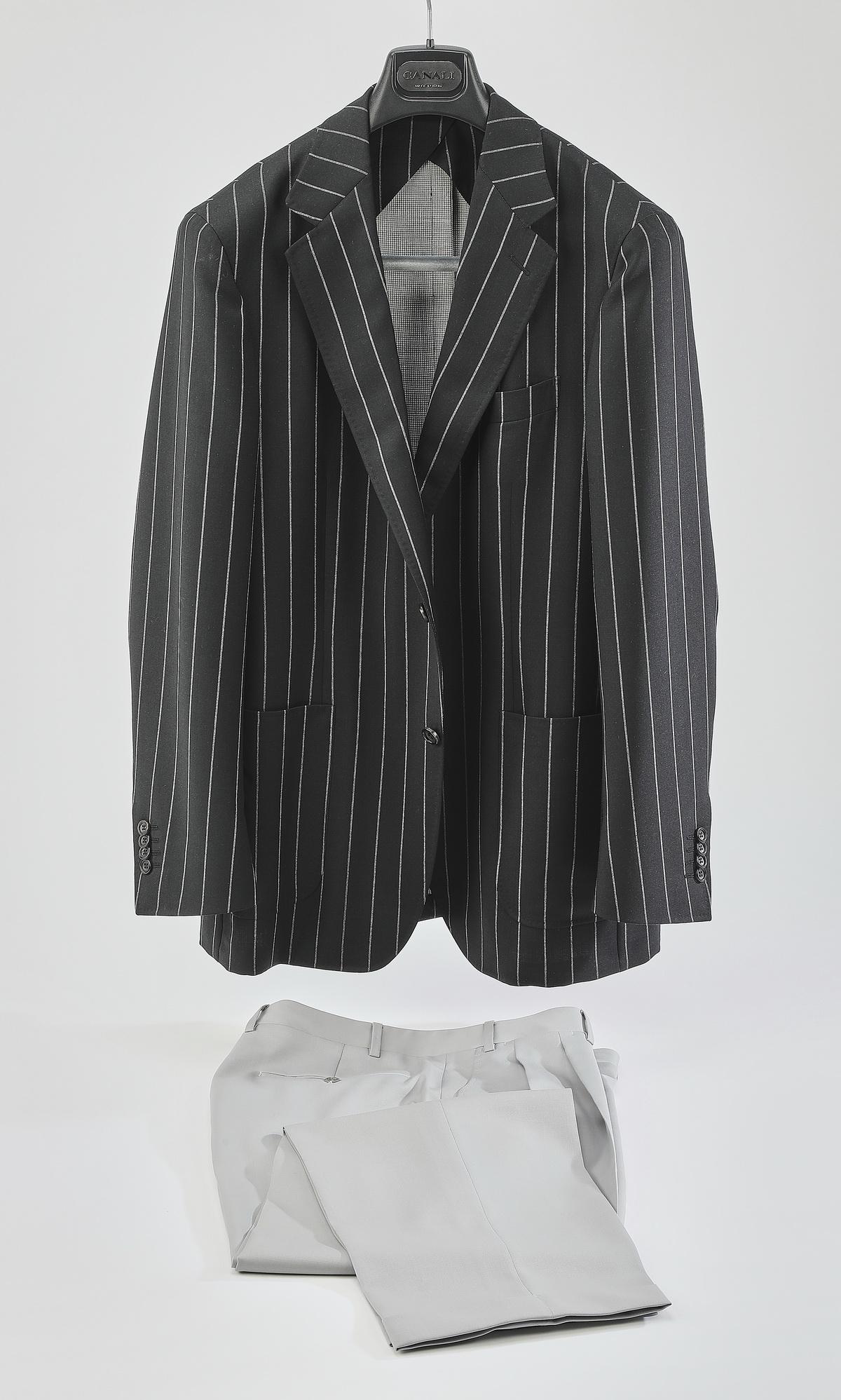 Canali Kei single breasted blazer and slacks: Canali Kei single breasted blazer and coordinating dress slacks, the coat of charcoal grey chalk stripe wool twill, having two buttons, the front pockets without flaps, with two back (side) vents, hav