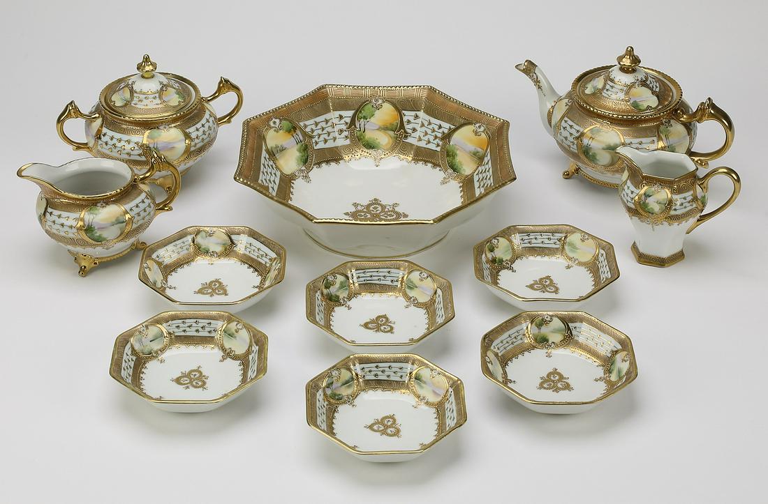 (11pc) Hand Painted Nippon dessert service, ca 1920: Hand Painted Nippon dessert service, circa 1920, decorated with densely enameled gilt designs on a cobalt blue and white background, interspaced with landscape reserves; comprising (1) serving bowl, 3