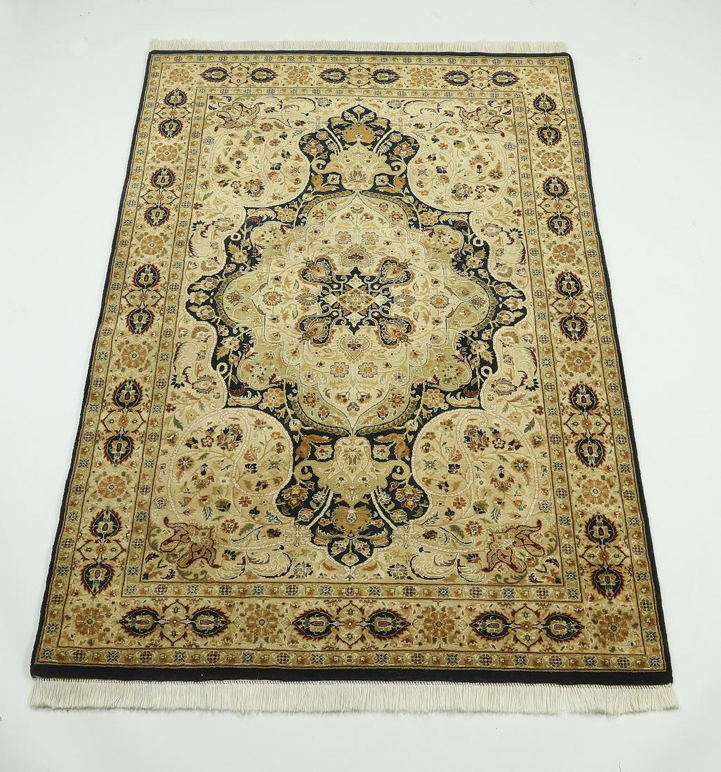 Hand knotted wool Pakistani Tabriz rug, 6' x 4': Hand knotted wool Pakistani Tabriz rug, centering a medallion within medallion with pendants, in navy, taupe, cream, tan, celadon, and cranberry, on a all over foliate field, with an alternating navy 