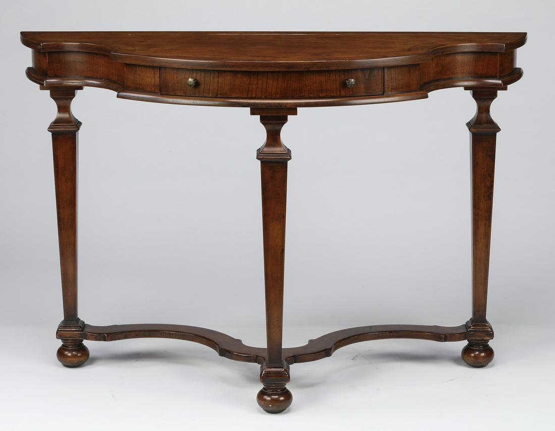 William and Mary style console table with drawer: William and Mary style console table, having a notched demi-lune top with string inlay above a wide apron centering one drawer, the whole rising on tapering square legs joined by 'os de mouton' stretc