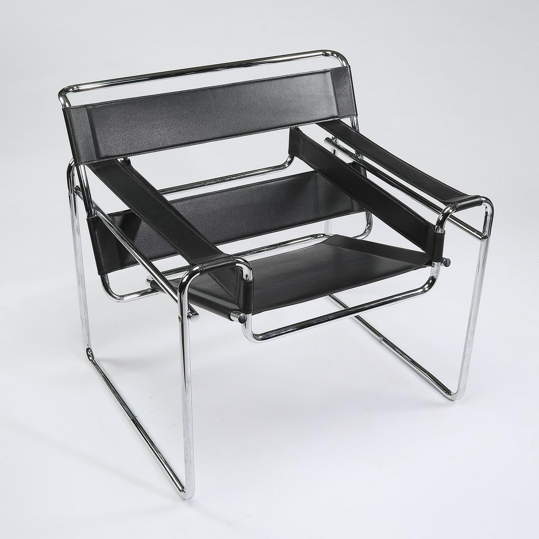 'Wassily' style leather and tubular metal armchair: Leather and tubular metal armchair in the manner of the Wassily Chair by Marcel Breuer, of square section, the back, arms, and seat, constructed of black leather straps attached to a tubular chromed m