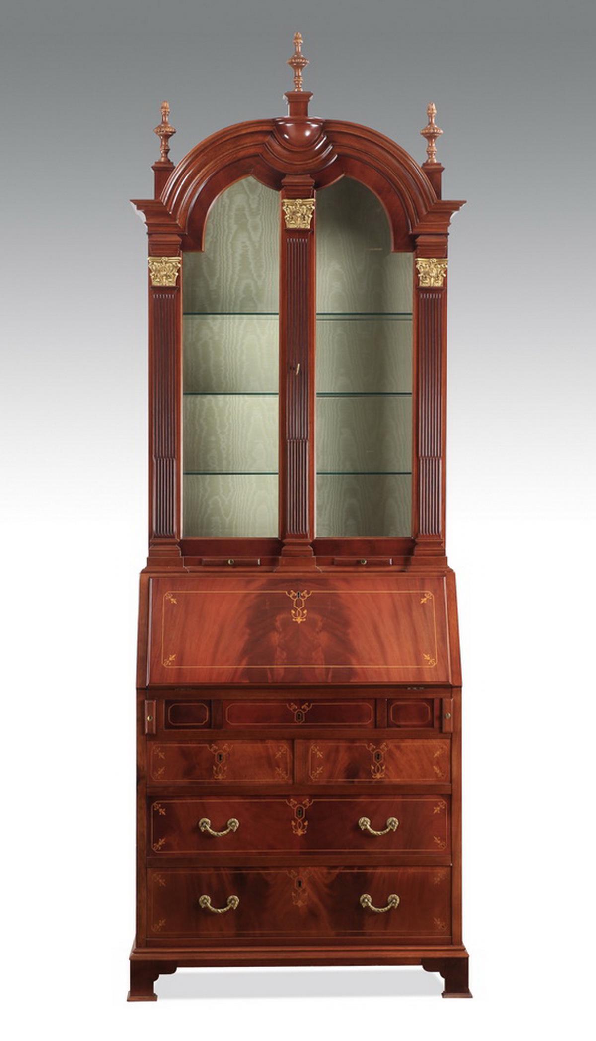 French Louis XV style secretary bookcase, 95"h: Continental secretary bookcase in the Louis XV taste, executed in mahogany and gilt bronze, having an arched cornice surmounted by three flame finials above two arched and glazed doors opening to a mo