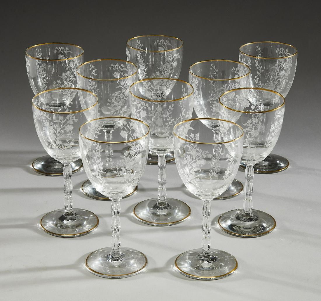 (10) Fostoria Rambler etched crystal wine glasses: (10) Fostoria Rambler pattern etched crystal wine glasses, executed in clear crystal, each having a gilt rim and an ovoid bowl etched with flowers and foliage arranged in vertical serpentine garlands,