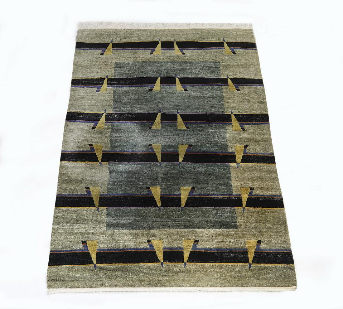 Nepalese hand knotted wool Contemporary carpet, 9 x 6: Nepalese hand knotted wool Contemporary carpet, having a full field of black horizontal stripes interspersed with pale yellow triangles over a central green rectangle framed by a pale green border, 9'
