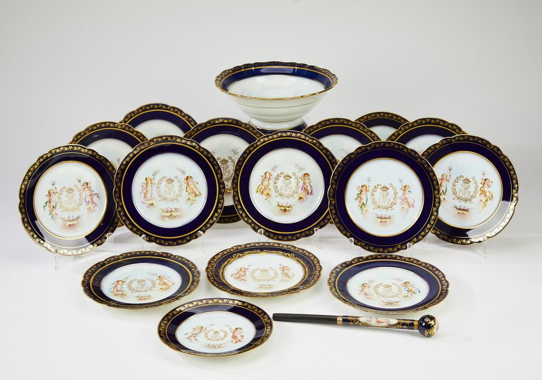 (17) Sevres Louis Philippe porcelain table articles: Set of (17) Sevres Louis Philippe porcelain table articles, circa 1846, all having a gilt-decorated vinework border on a cobalt ground centering the monogram of Louis Philippe flanked by putti, maker'
