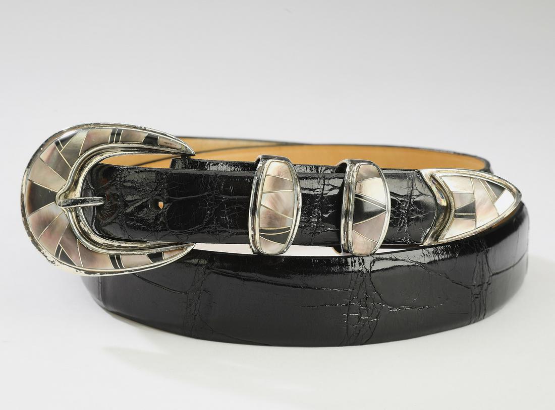 Black alligator ranger belt w/ inlaid sterling buckle: Alligator leather ranger belt with inlaid sterling buckle by B. G. Mudd, the black belt having a blackstone and mother of pearl southwestern inlaid sterling buckle, two loops and a tip, marked 'BGM St