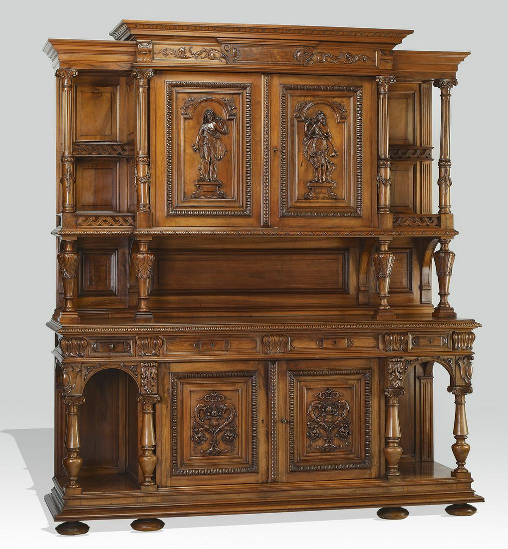 Monumental late 19th c. French walnut buffet: Monumental late 19th century French walnut buffet a deux corps, having a molded cornice and relief carved frieze with rinceaux, rising on molded doors relief carved with classical figures, flanked by 