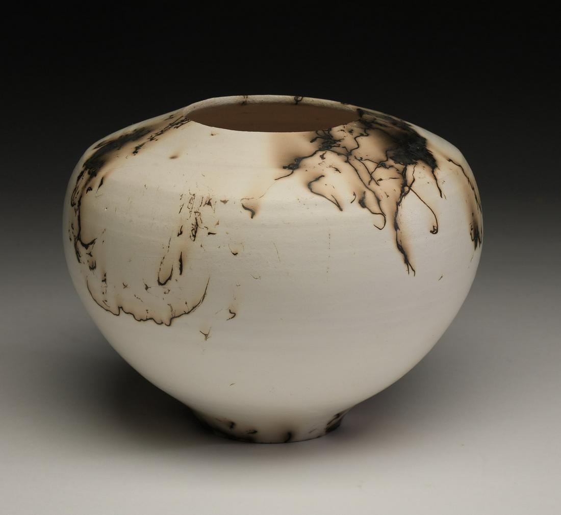 Copper flash raku ceramic pot by Bruce Johnson: Bruce Johnson (American, active), copper flash raku ceramic pot, of globular form, having a matte copper flash raku glaze in ebony and ivory hues, 6"h x 7"dia.