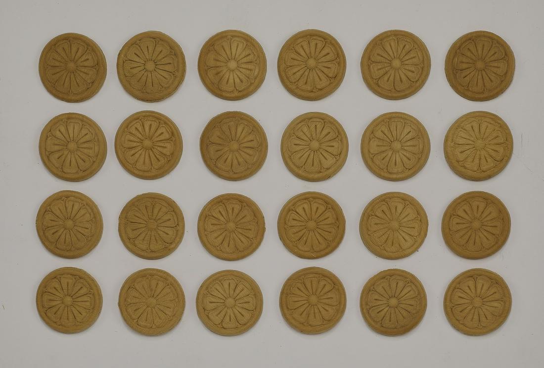 (24) Italian carved rosette decorative appliques: Group of (24) Italian decorative appliques, executed in carved wood, of circular form with foliate decoration, made in Italy, ready for your stained or painted finish, measuring 0.25"h x 1.75"dia.
