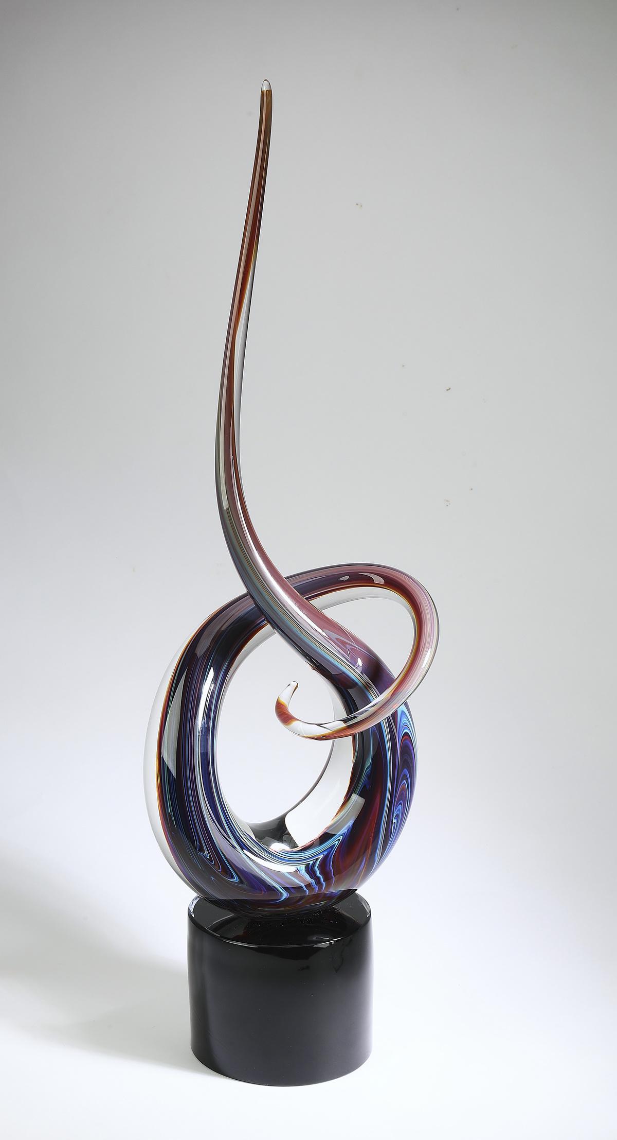Murano abstract art glass sculpture, ca 1970: Murano abstract art glass sculpture, circa 1970, executed in dark amethyst shading to clear, raised on black glass cylindrical bases, 20.75"h x 6.5"w x 5.5"d.
