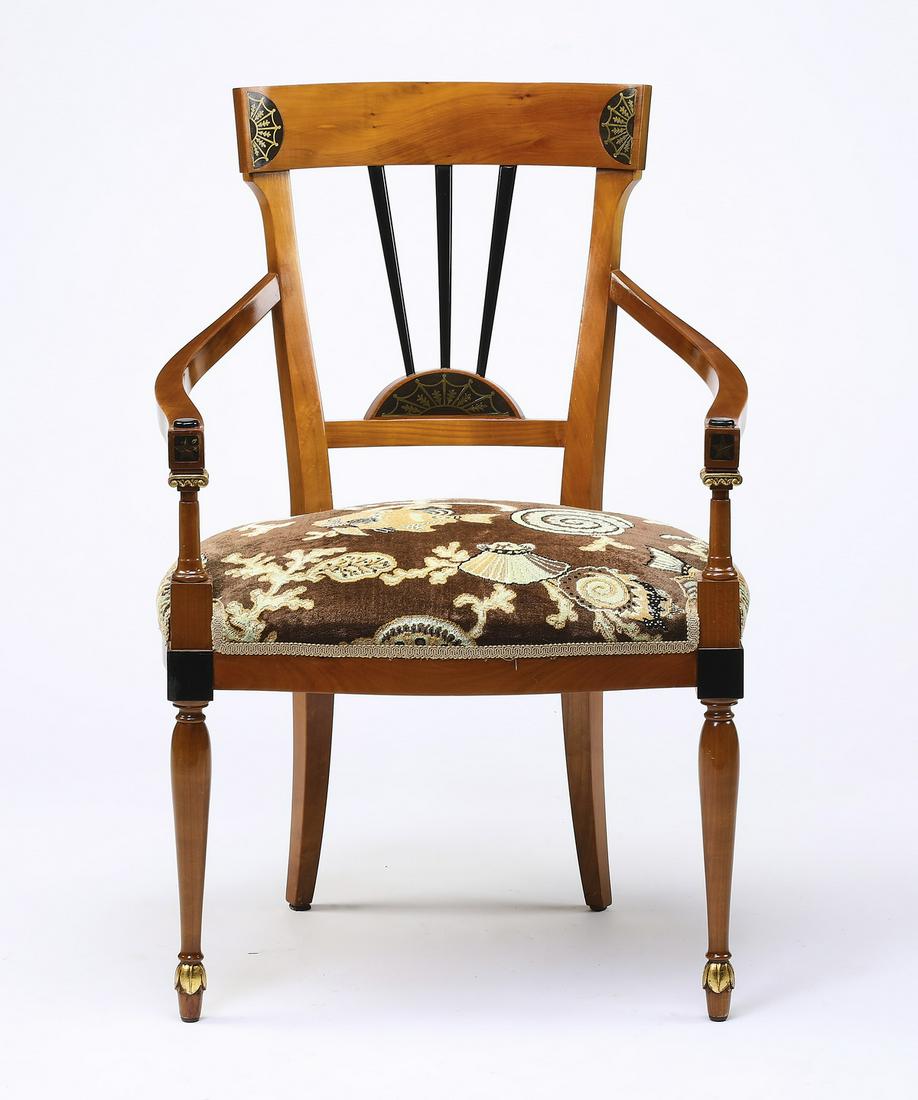 Custom upholstered Sheraton style mahogany armchair: Sheraton style mahogany armchair, having a paint-decorated crest rail depicting demilune gilt-decorated designs, surmounting the radial spindle back, leading to curving arms, above the custom upholste
