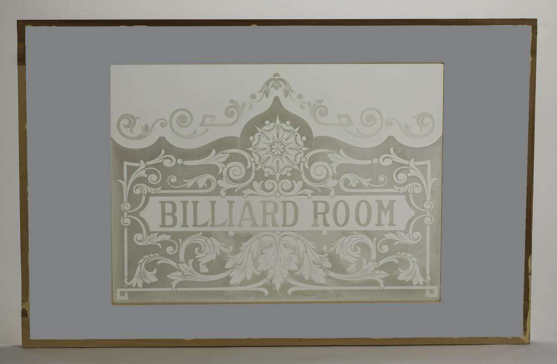 'BILLARD ROOM' etched glass panel, 60"w: 19th century rectangular etched glass architectural panel, having a central glass panel centering the legend 'BILLARD ROOM' surrounded by scrollwork and topped with a rosette, the whole in a beige pai