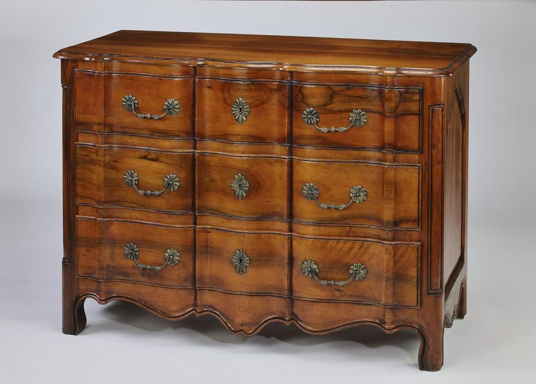 19th c French Provincial style elm commode: French Provincial style commode, late 19th century, executed in elm, having a scalloped surface rising on three conforming long drawers, above a scalloped apron, terminating in pad feet, 35.75"h x 49.