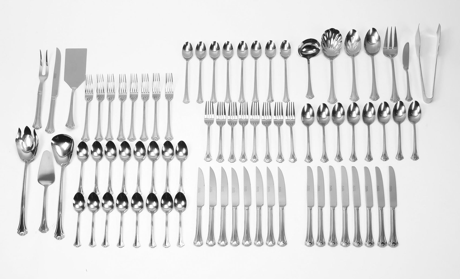 (77 pcs) Reed and Barton French Country stainless: Service for eight of Reed and Barton stainless steel in the French Country pattern, comprising (8) each, place fork, salad fork, place spoon, ice tea spoon, place knife, and steak knife, together with
