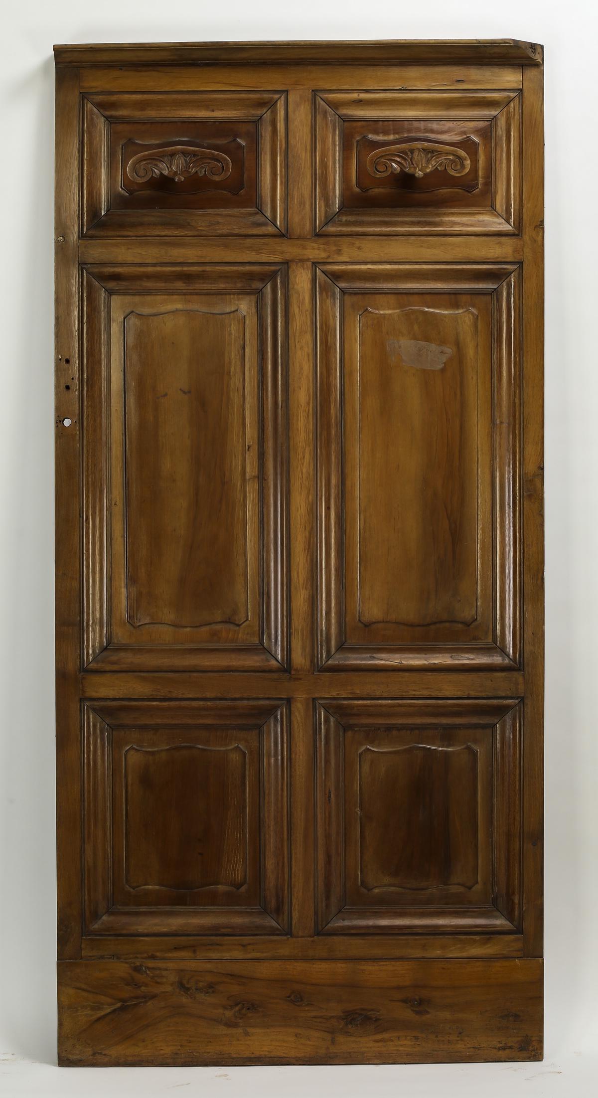 19th c. French walnut panel w/ carved coat hooks 75"h: 19th century French carved walnut architectural panel, having a pair of decorative carved wood coat hooks above raised panels, 75"h x 35.75"w x 5"d.