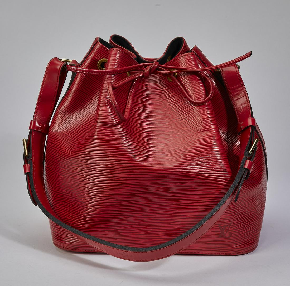 Authentic Louis Vuitton Epi Red Noe PM: Authentic Louis Vuitton Epi Red Noe PM, having an adjustable shoulder strap and gold-tone hardware, the drawstring closure opening to a suede lined interior, serial number AR0924, 10.25"h x 9.5"w x 7"