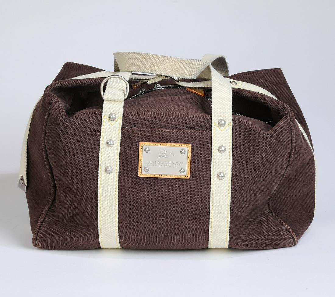 louis vuitton silver duffle bag