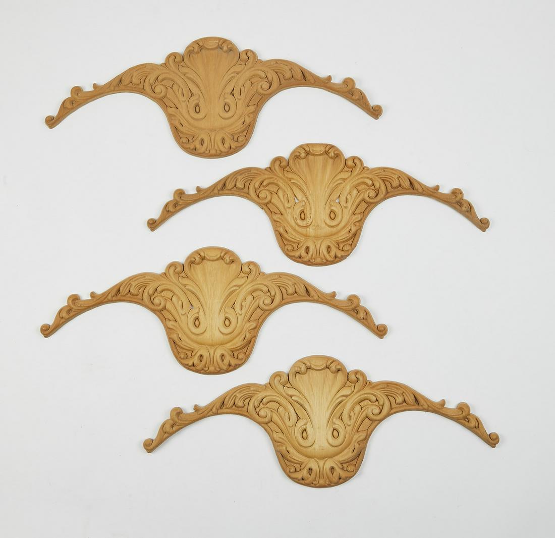 Group of (4) Italian carved acanthus appliques, 22"w: Group of (4) Italian carved appliques, each in the shape of scallops centered by acanthus scrollwork, marked 'Made in Italy,' ready for your stained or painted finish, 8"h x 21.5"w x 0.5"d.