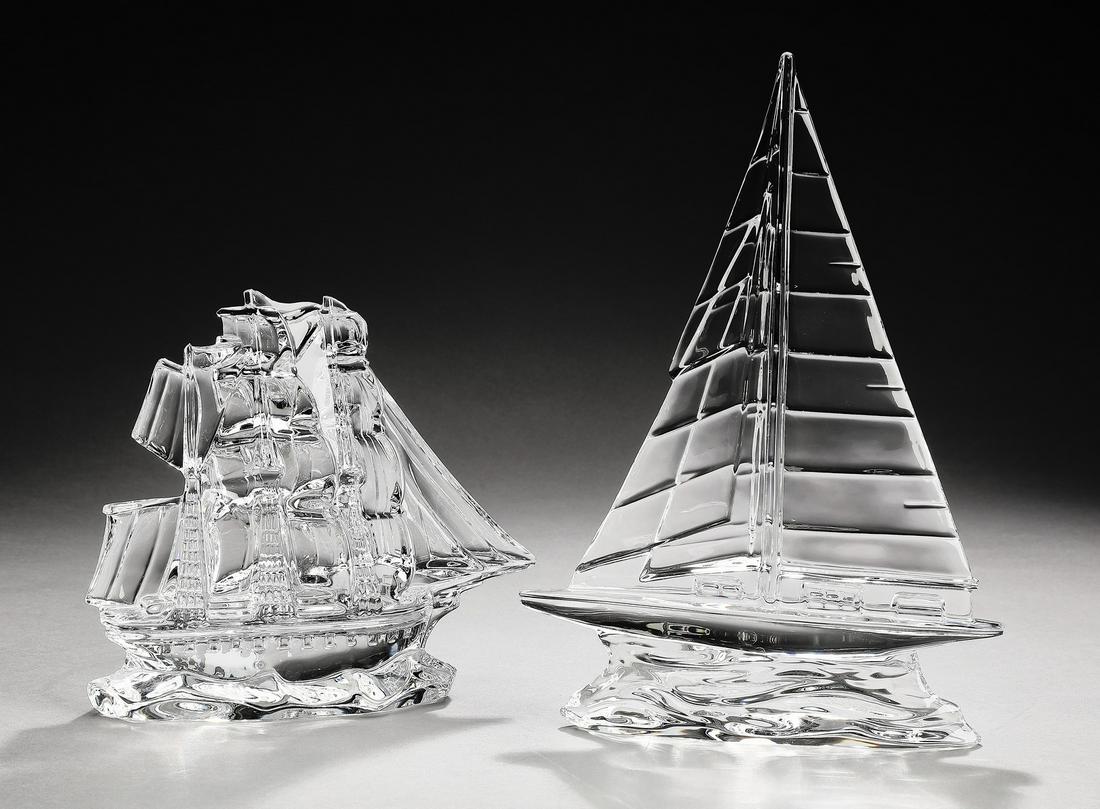 (2) Waterford crystal nautical sculptures, marked: Two Waterford crystal nautical sculptures, executed in clear crystal, comprising (1) 18th century ocean vessel with multiple masts and sails, maker marked, 5.75"h x 6.5"w x 2.5"d, and (1) 20th century