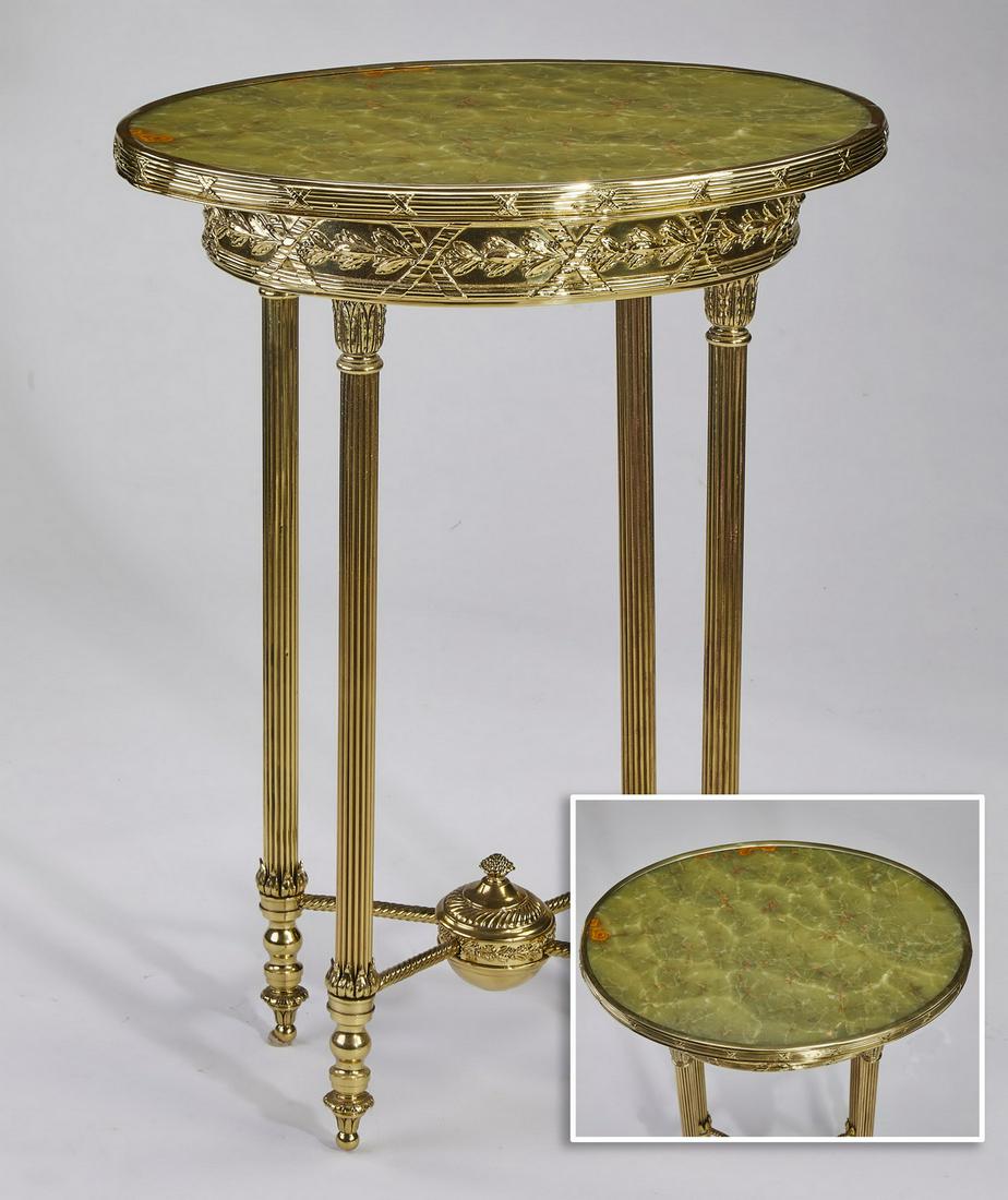 French green onyx and gilt mounted gueridon: Onyx and gilt mounted French gueridon in the Neoclassical taste, having an oval green onyx top captured in a gilt frame, surmounting a wide apron molded to look like ribbon wrapped laurel, the whole r