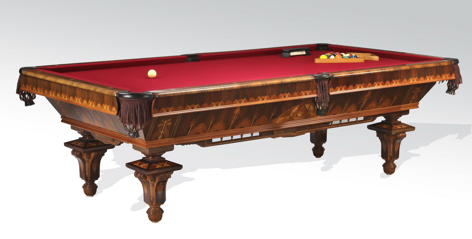 Custom crafted Italian marquetry inlaid pool table: Custom crafted Italian mahogany and satinwood inlaid pool table, having a red felt playing surface with six leather and fringe pockets accented with enamel and mother of pearl diamond inlays, above th