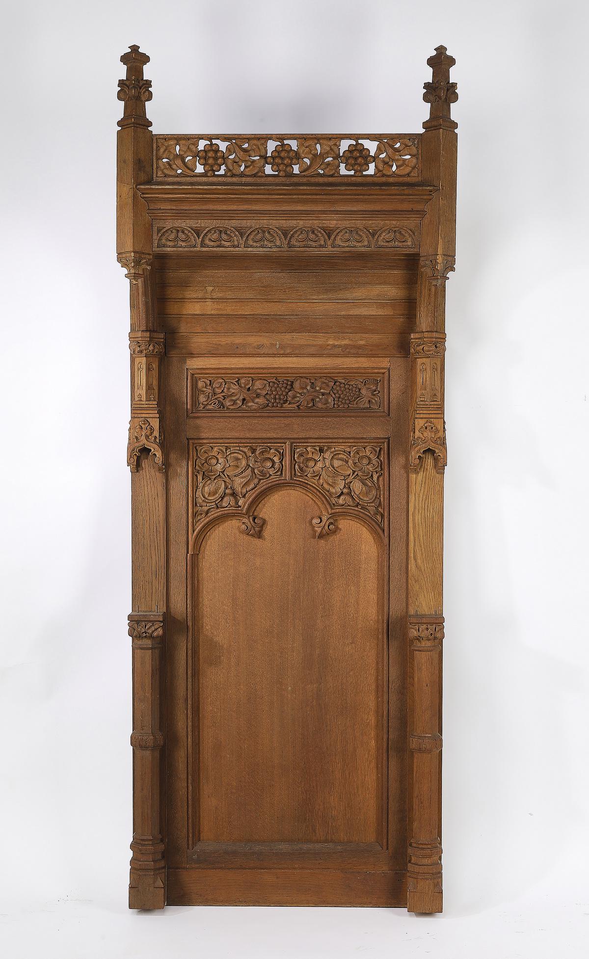 19th c. French Gothic Revival oak architectural panel: 19th century French Gothic Revival carved oak architectural panel, having a pierce carved gallery depicting grapevines flanked by spires with foliate crockets, rising over the mansard canopy, above th