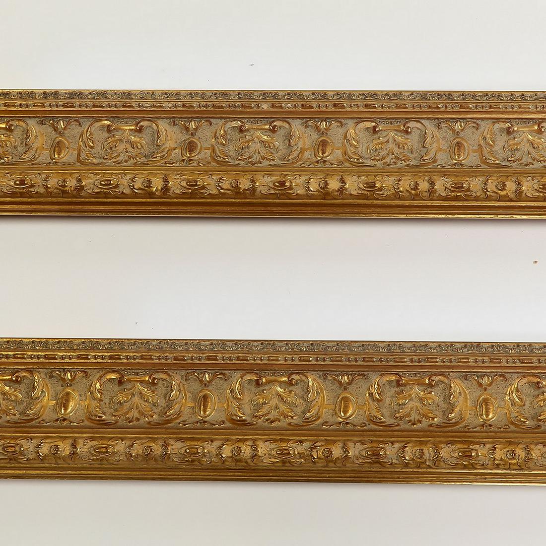 (2) Italian carved and gilt decorative moldings, 118": Pair of Italian carved and gilt decorative moldings, having three borders of acanthus leaves, each measuring 4"h x 118.5"l x 2"d.