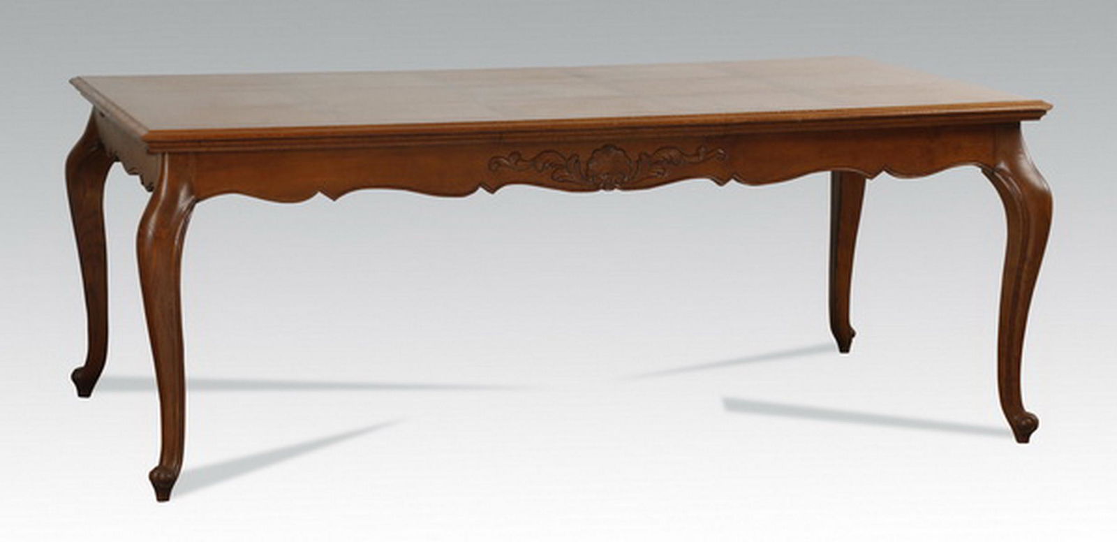 French Provincial style oak table w/ two leaves: French Provincial style oak dining table, the shaped rectangular top with parquetry inlay surmounting a floriate shaped apron, with two leaves, raised on cabriole legs, 30.5"h x 78.5"l x 44"w, with le