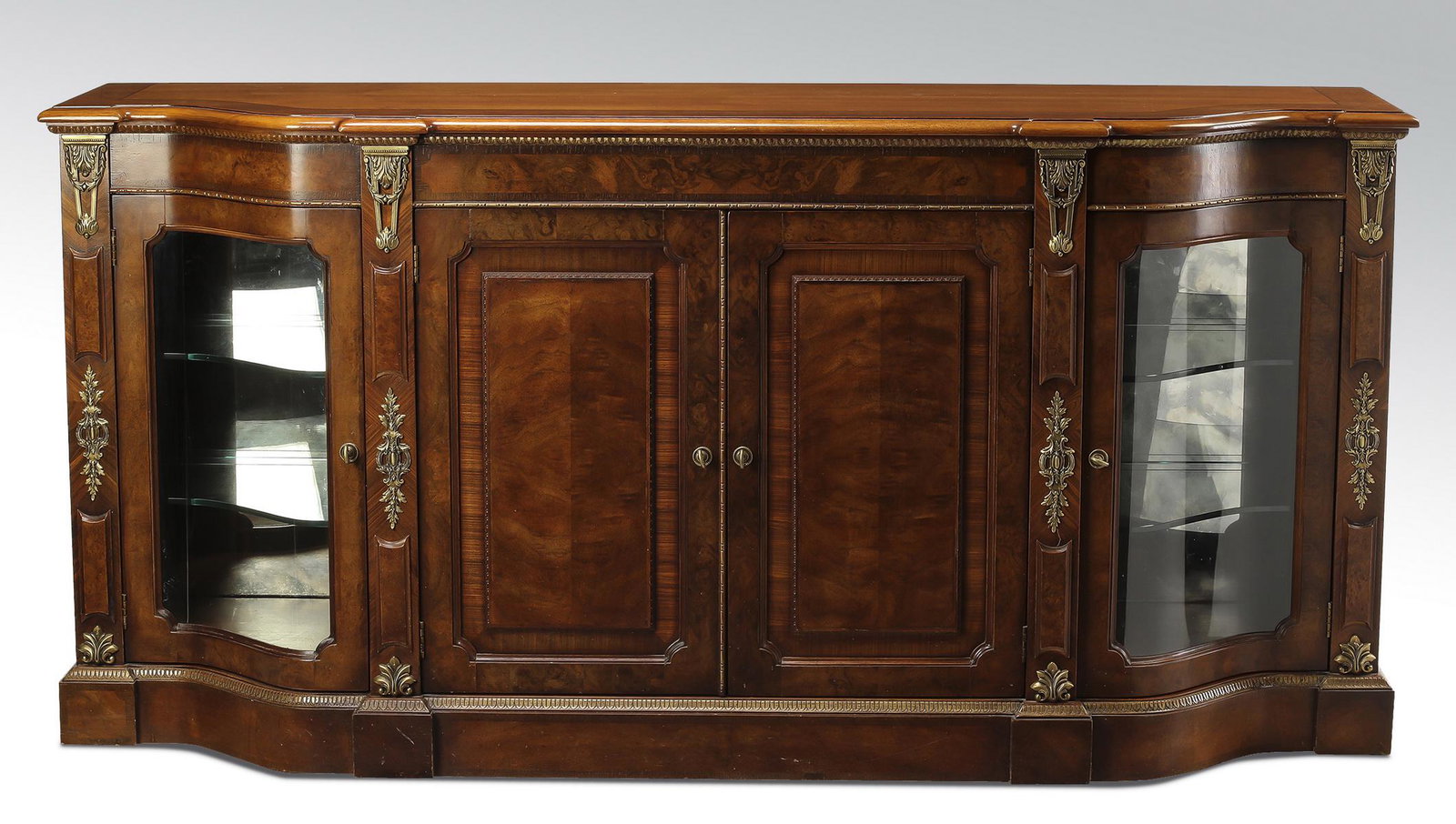 Henredon 'Grand Provenance' serpentine buffet: Henredon "Grand Provenance" mahogany and birds eye maple serpentine breakfront buffet, having a banded serpentine top over a conforming cabinet, centering two paneled doors, opening to storage includi