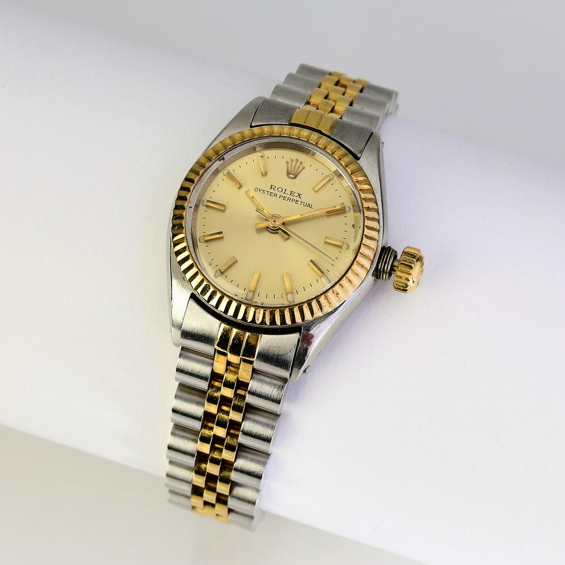 Ladies Rolex Oyster Perpetual, 18k and stainless: Ladies Rolex Oyster Perpetual, executed in stainless steel and 18k gold, the 25mm case having a gold dial with gold stick markers framed by an 18k gold fluted bezel, with a stainless steel and 18k yel