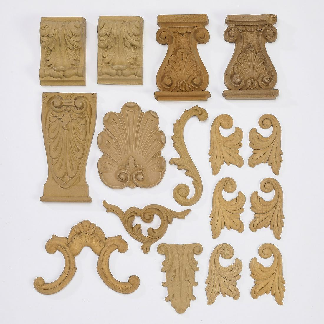 (16) Continental carved wood appliques: Group of (16) carved wood appliques, each ready for your own stained or painted finish, including (2) of acanthus leaf form, 3.75"h x 2"w x 1.5"d, (2) of columnar form centering shell motifs, 4.75"h x