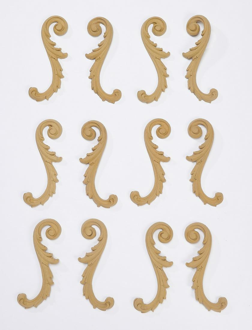 (12) Carved wood acanthus scrollwork appliques, 6"h: Group of (12) carved wood appliques, each of acanthus scrollwork form, ready for your own stained or painted finish, 5.75"h x 2"w x 0.25"d.