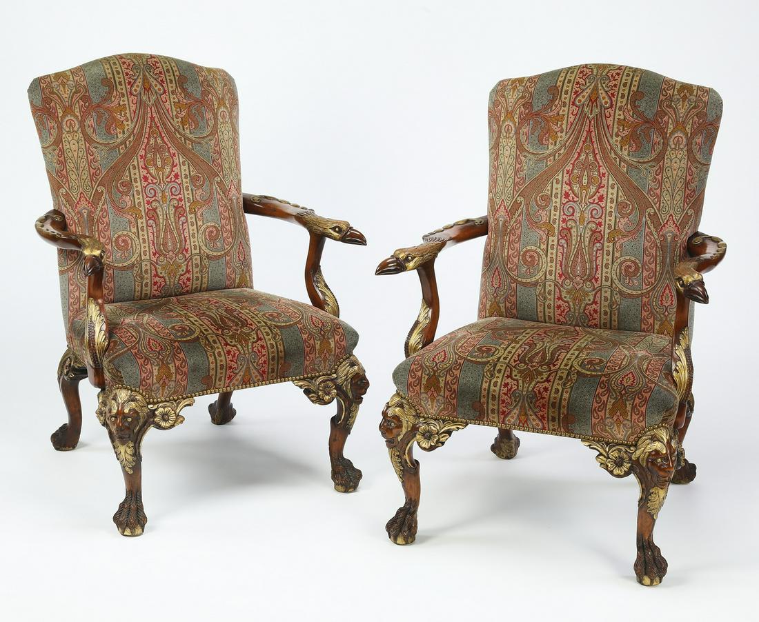 (2) Parcel gilt mahogany Gainsborough style armchairs: Pair of mahogany and parcel gilt Gainsborough style armchairs, each having an arched back flowing to figural carved arms with eagle head terminals, resting on acanthus carved supports, flanking a squa