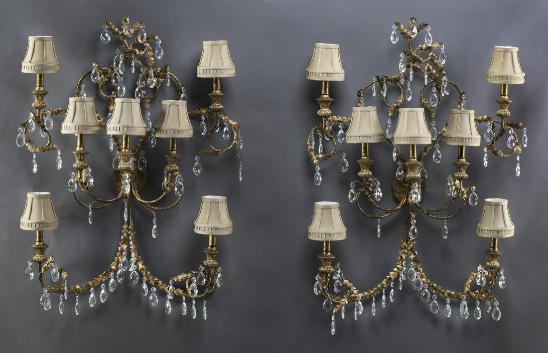 Pair of oversize crystal 7-light sconces: Pair of large and impressive gilt metal, wood, and crystal 7-light sconces, having petite shades surmounting naturalistic scrollwork arms with drop crystals, 40"h x 31"w x 10"d.