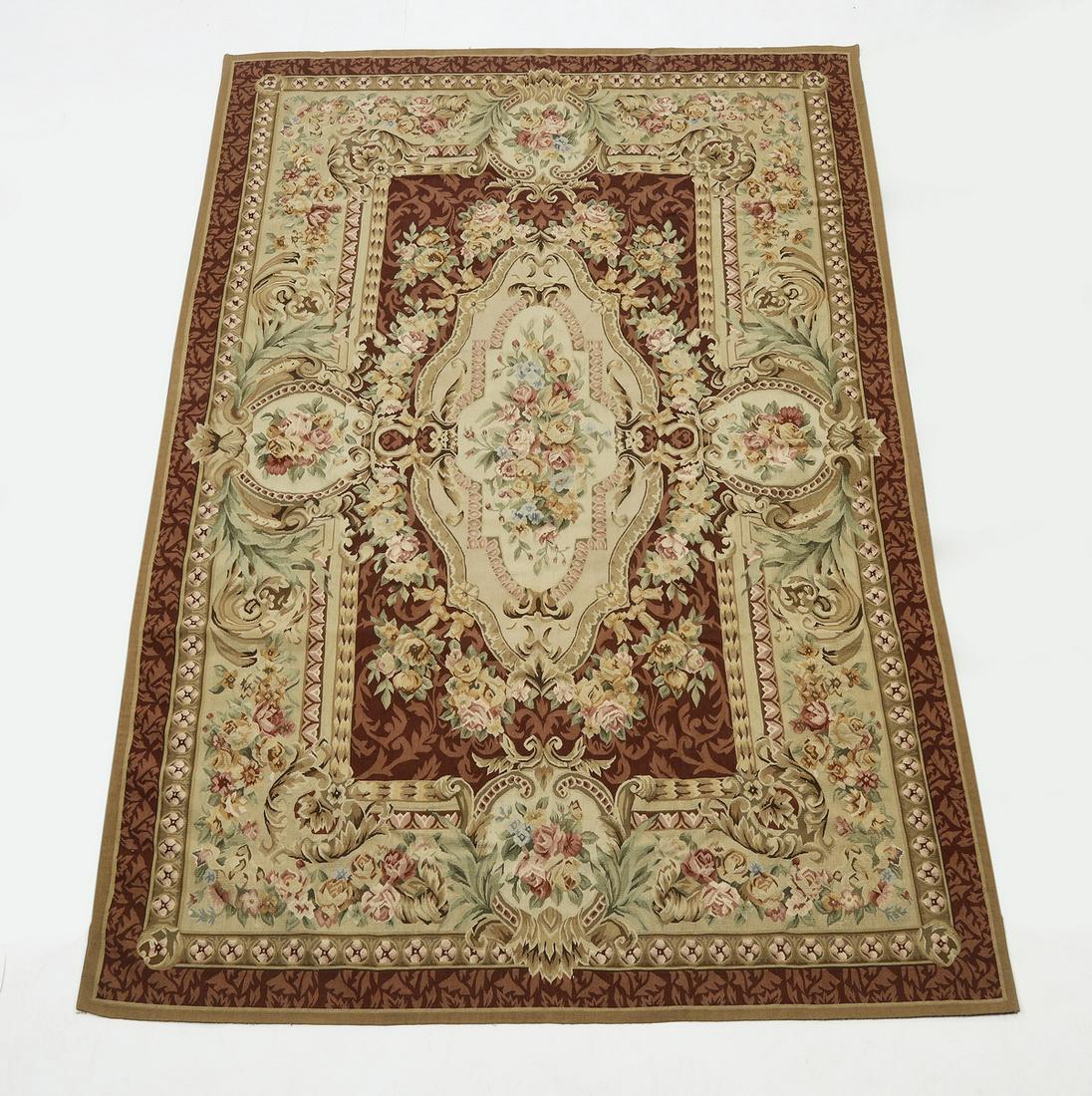 Hand woven wool Sino-Aubusson carpet, 9 x 6: Hand woven wool Sino-Aubusson carpet, having a floral medallion with pendants in celadon, rose, blush, slate blue, and cream on a burgundy ground, with a floral border on a celadon ground, 9'l x 6'w.