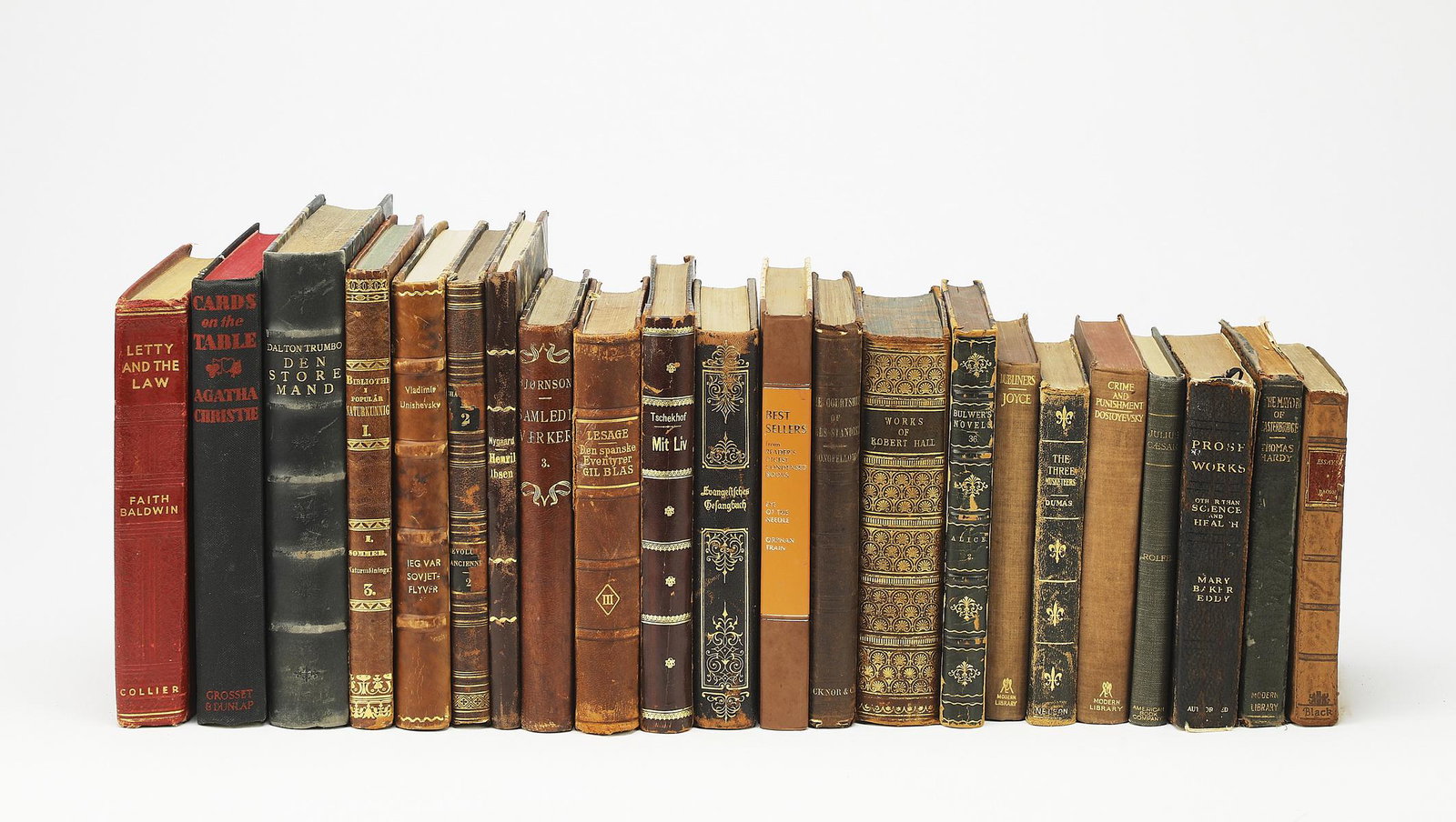 (22) 19th and 20th c. books with decorative spines: Group of (22) 19th and 20th century books, each having a decorative spine, in a variety of languages on various topics, smallest measuring 6.25"h x 4.25"w, largest measuring 8.75"h x 6"w.